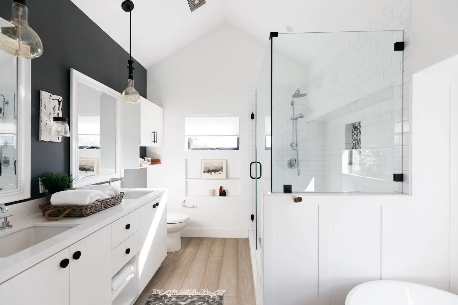 Remodeled bathroom with a frameless glass walk-in shower and double vanity