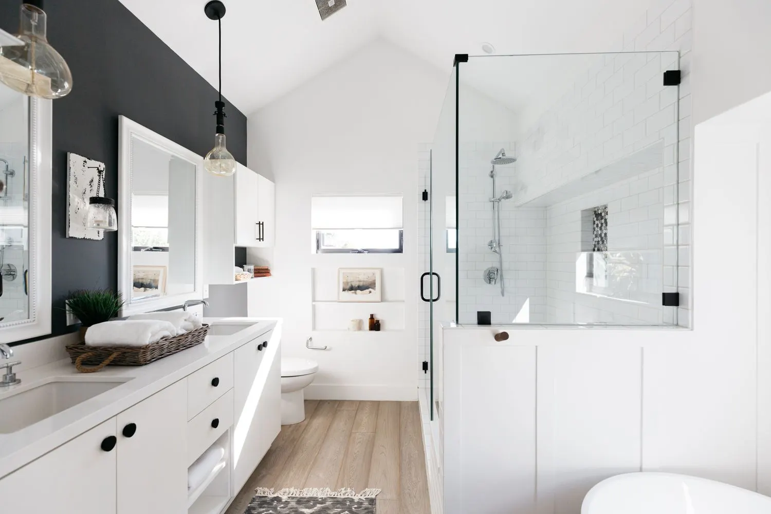 Remodeled bathroom with a frameless glass walk-in shower and double vanity